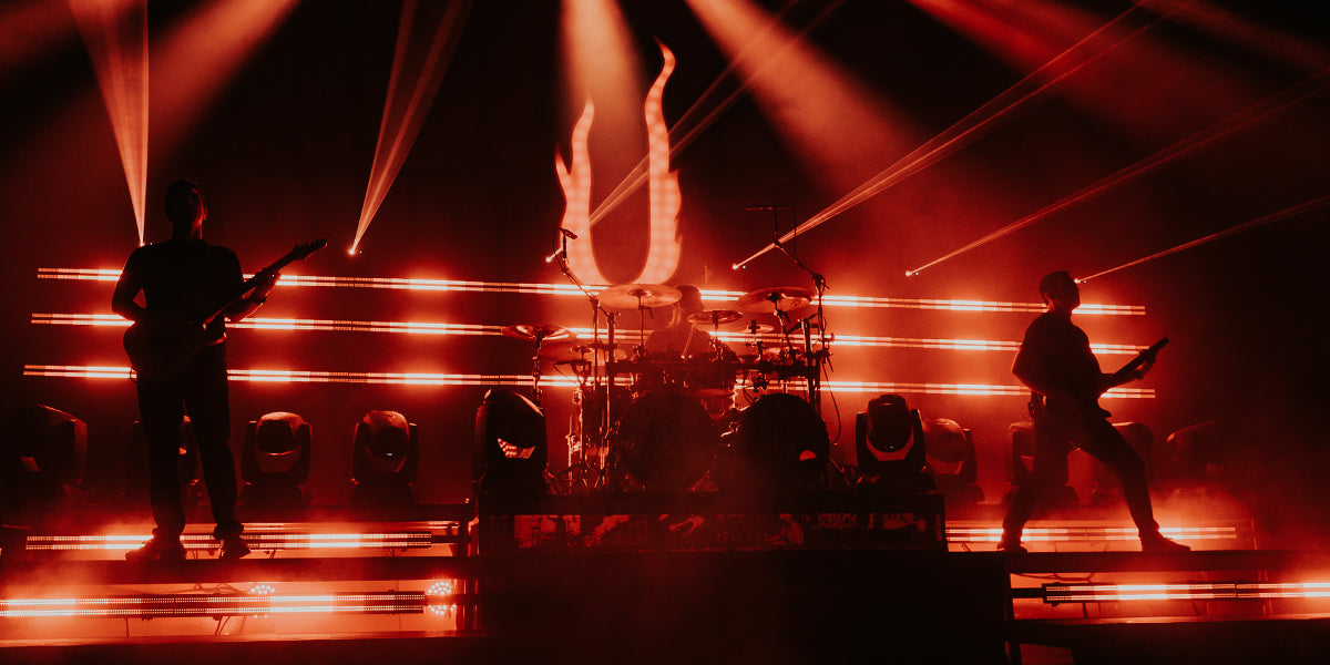 Photo of the ADJ Lighting Jolt Bar fixtures on stage with a live band